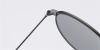 Round glasses with golden frame and flash green lenses
