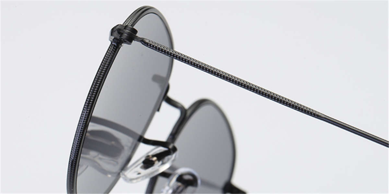 Round glasses with golden frame and flash green lenses
