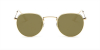 Round glasses with golden frame and golden sunglasses lenses